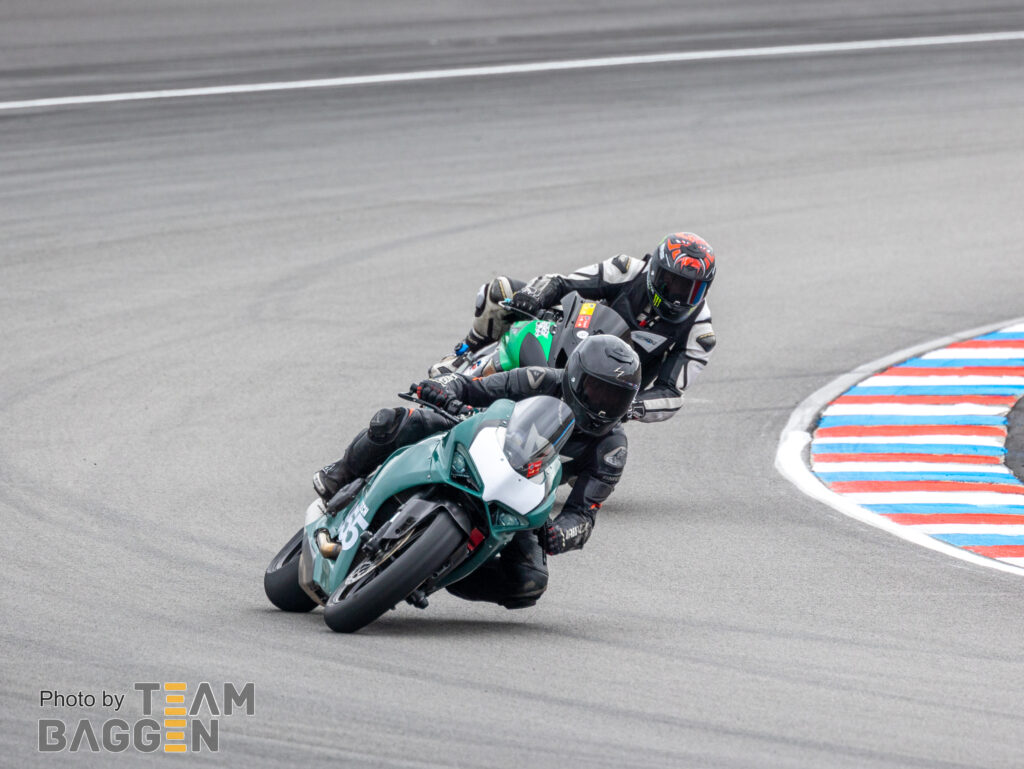 Motorcycle racing, two riders - Ducati Panigale and Kawasaki